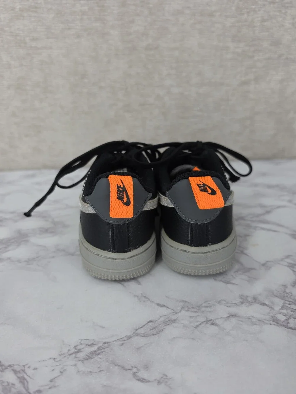 Nike Air Force Lv8 Kids Black & Gray Low-Top Sneakers with Orange Accent